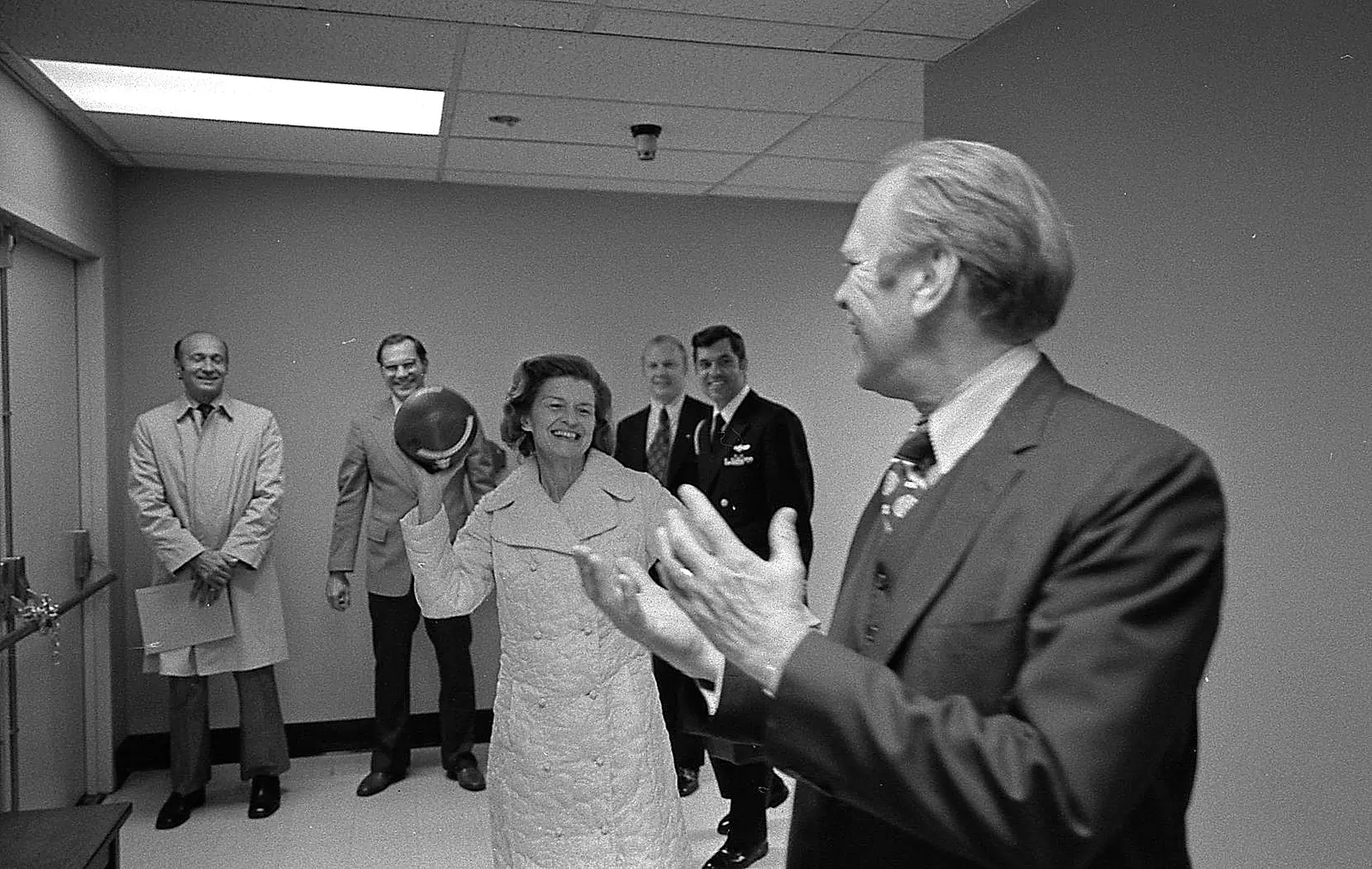 Medical professionals in a modern hospital hallway